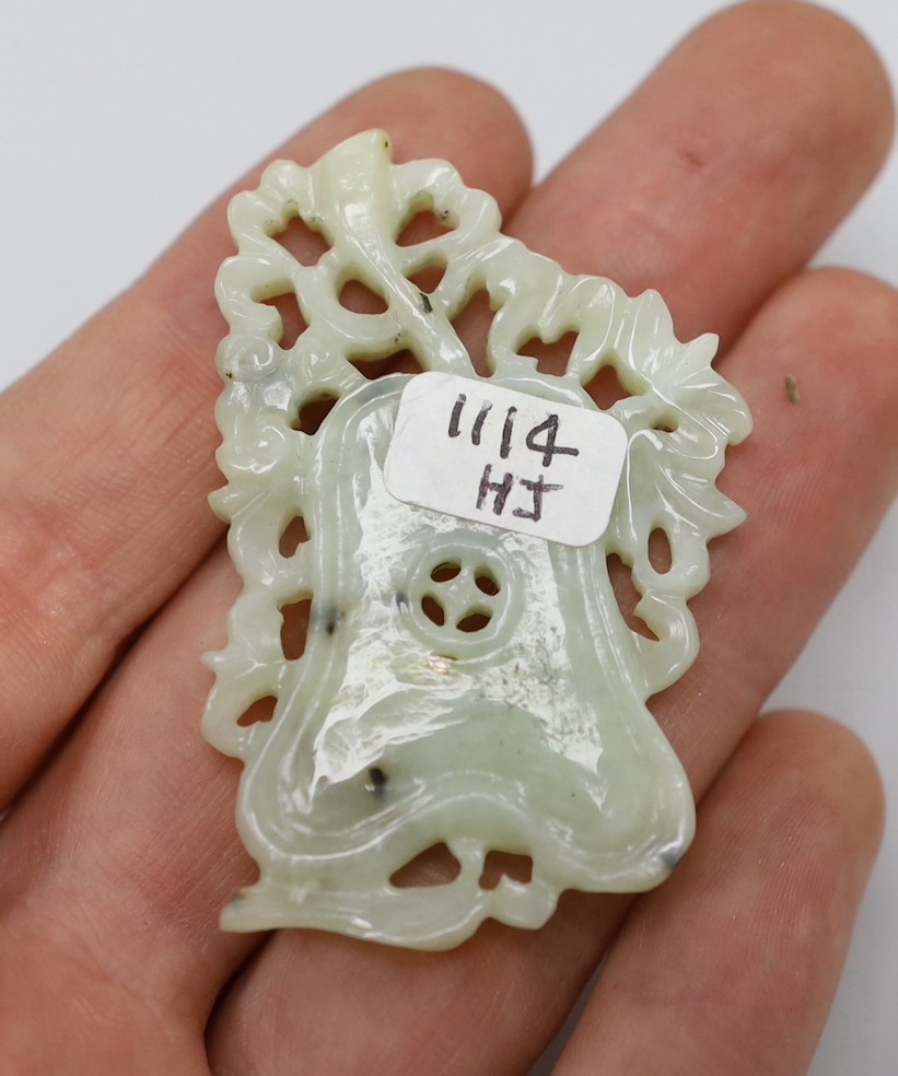 Three Chinese archaistic jade or hardstone carvings, a huang, bi disc, plaque